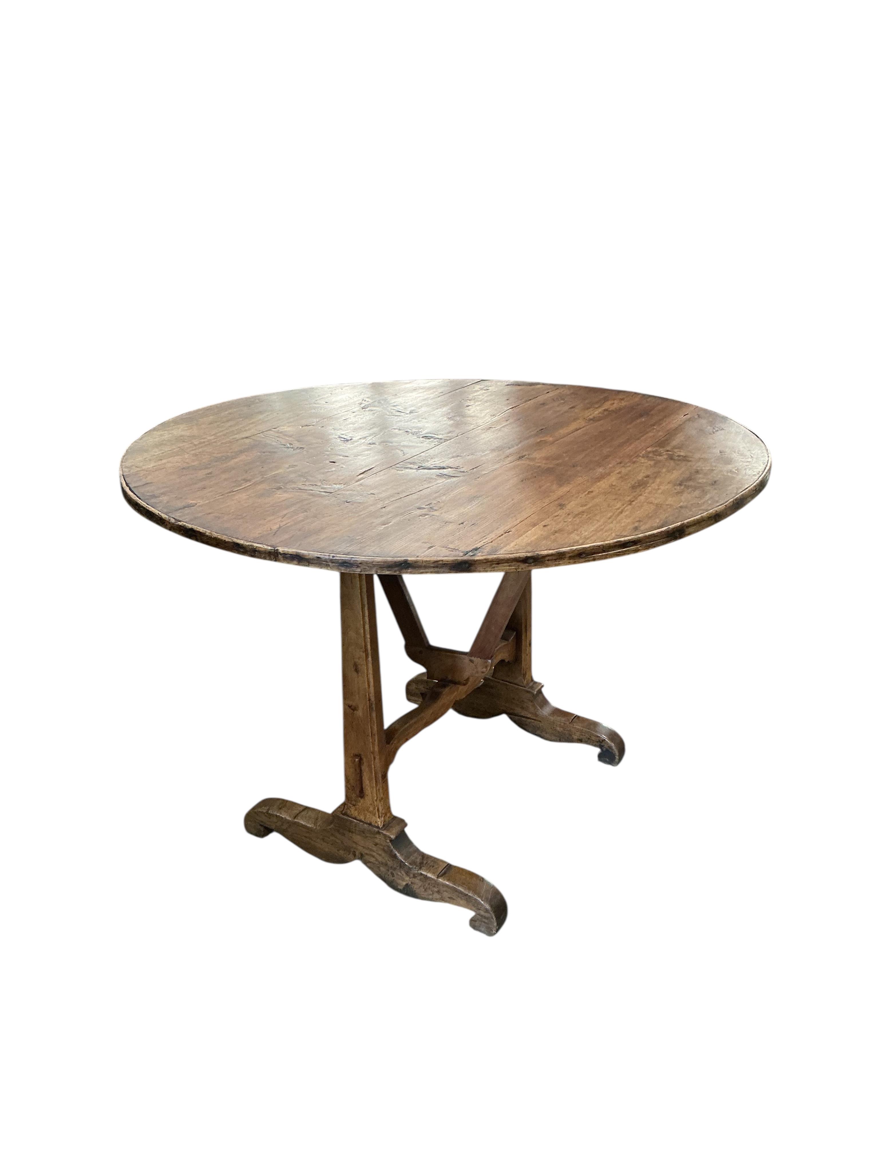 A 19th century French fruitwood wine tasting table, diameter 100cm, height 67cm